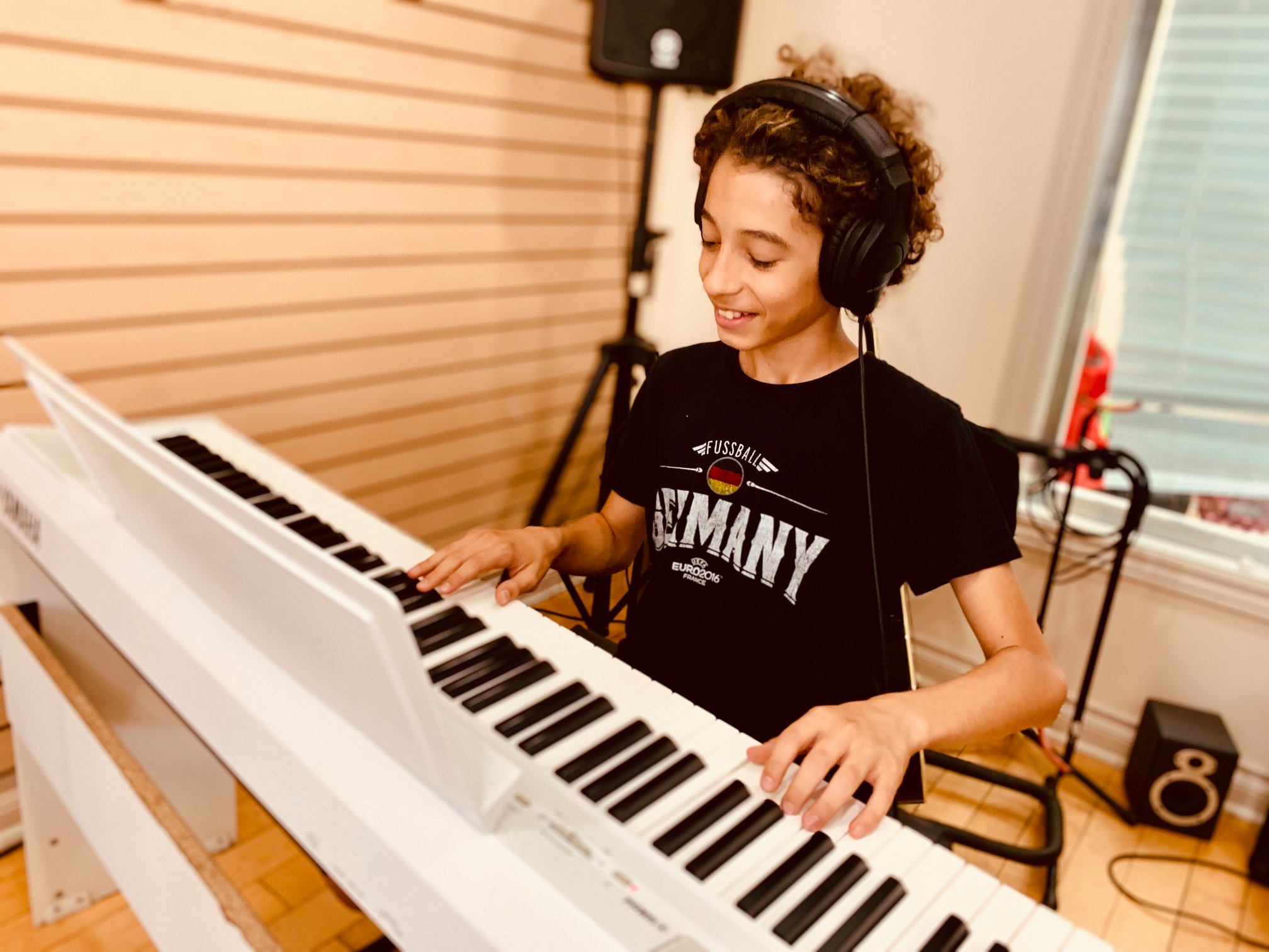 student playing the piano during a piano lesson