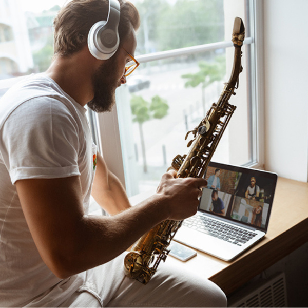student playing the saxophone during an online lesson in Toronto