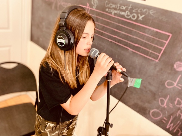 Student taking a voice lesson in Toronto with a vocal instructor