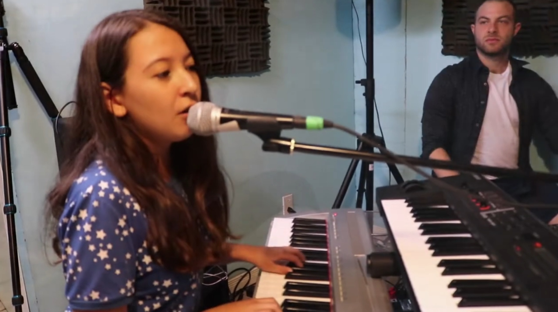 Student rehearsing piano and voice during a collaborative band program at Elite Music Academy in Toronto