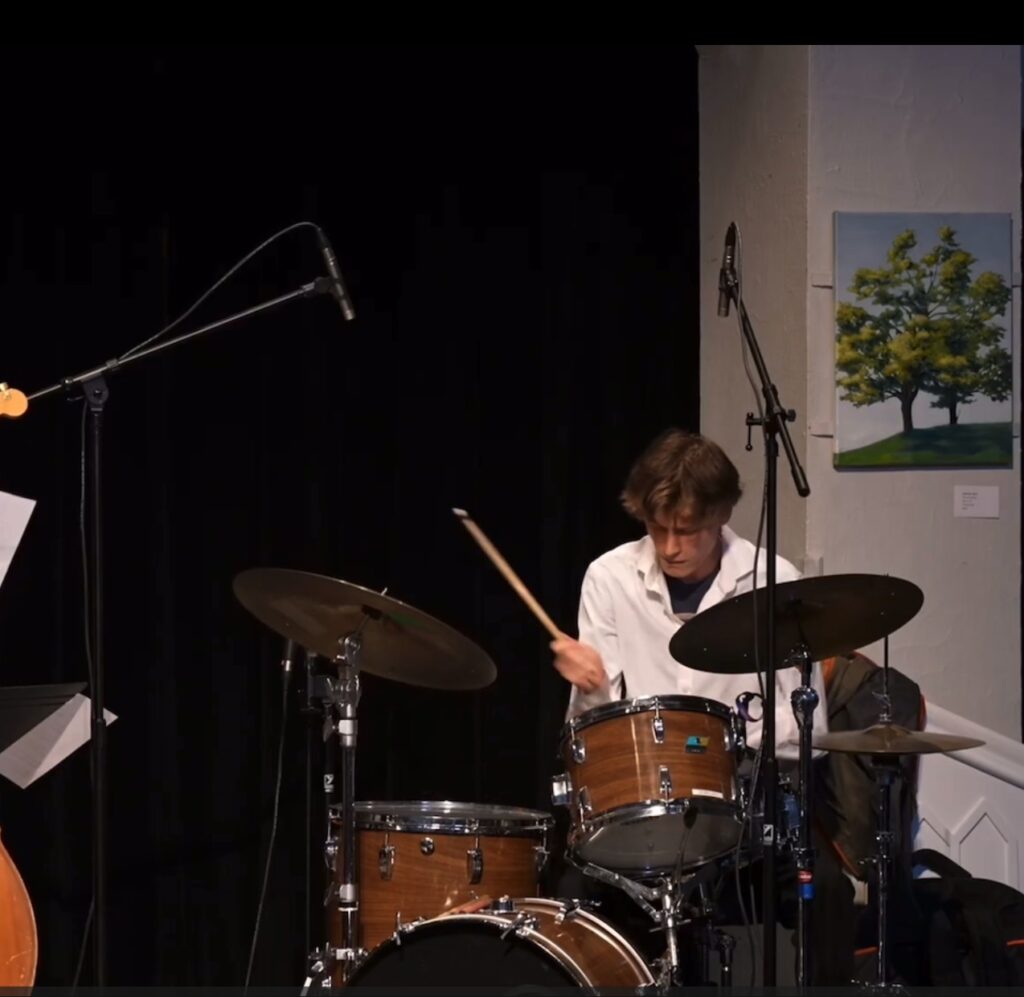 Graham C performing live on drums at a University of Toronto ensemble performance