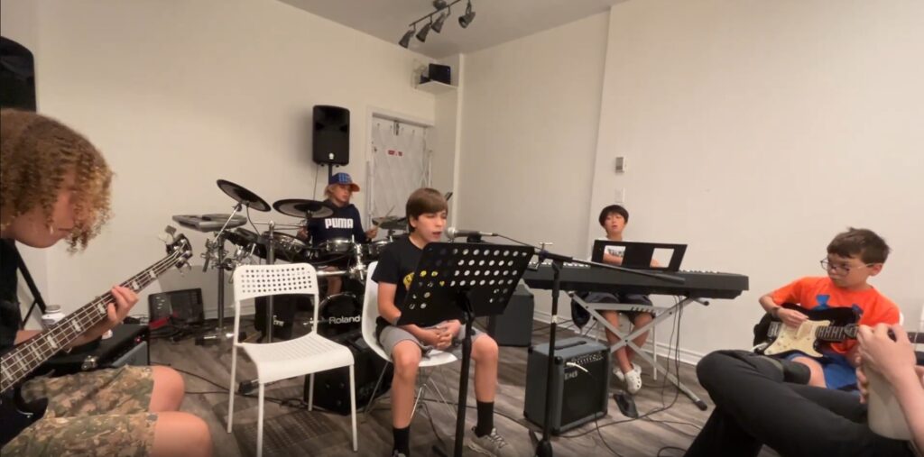 Students rehearsing together in Elite Music Academy's Band Program in Toronto.