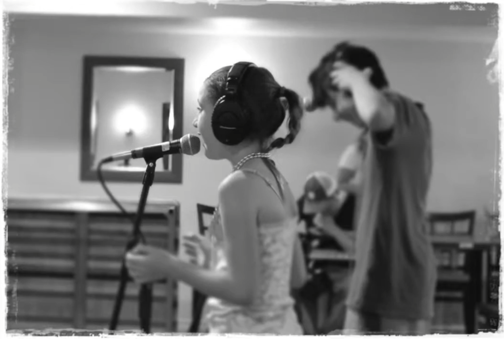 Students rehearsing vocal and instrumental parts during an Elite Music Academy Band Program in Toronto.