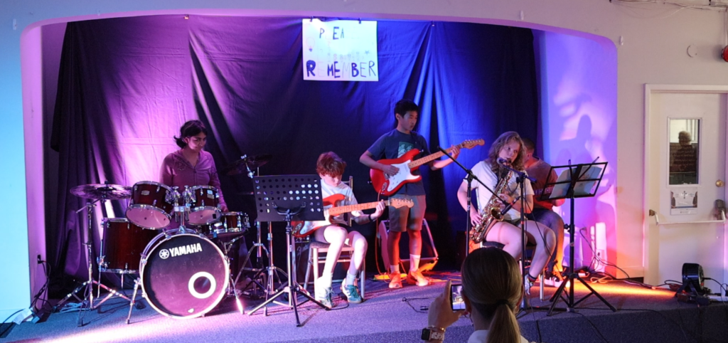 Students performing during an Elite Music Academy Summer Music Camp showcase in Toronto