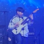 Sangho L. playing electric guitar on stage – Guitar & Bass Lessons on the Danforth at Elite Music Academy.