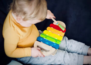 Baby playing instrument